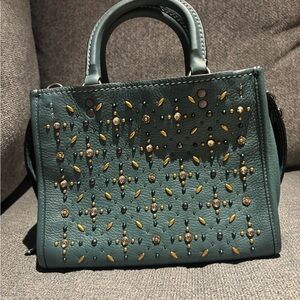 NWOT Coach 1941 Rogue 25 in Dark Turquoise with Prairie Rivets